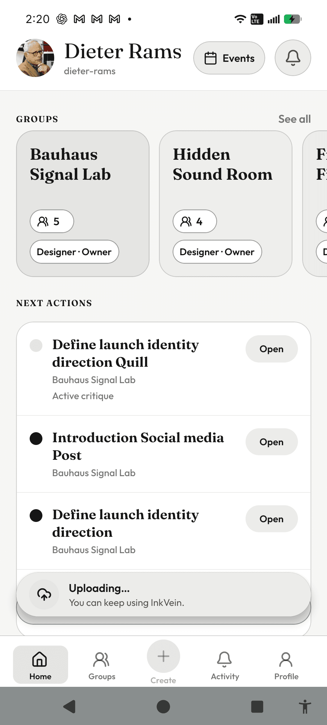 InkVein home screen with a persistent Uploading status surface above bottom navigation.